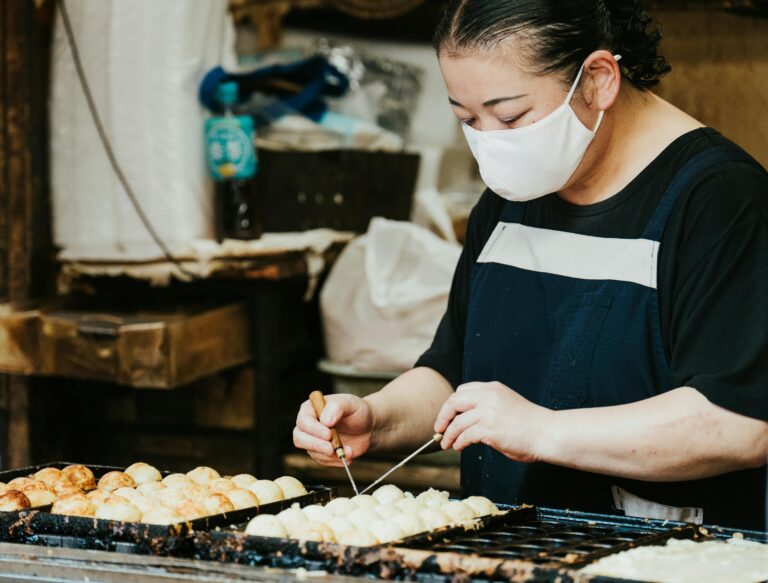 Navigationpaths.com | Amazing Things to Do in Himeji Castle That Locals Secretly Love Street food stall in Himeji selling grilled skewers and rice cakes – discover local flavors on NavigationPaths.com
